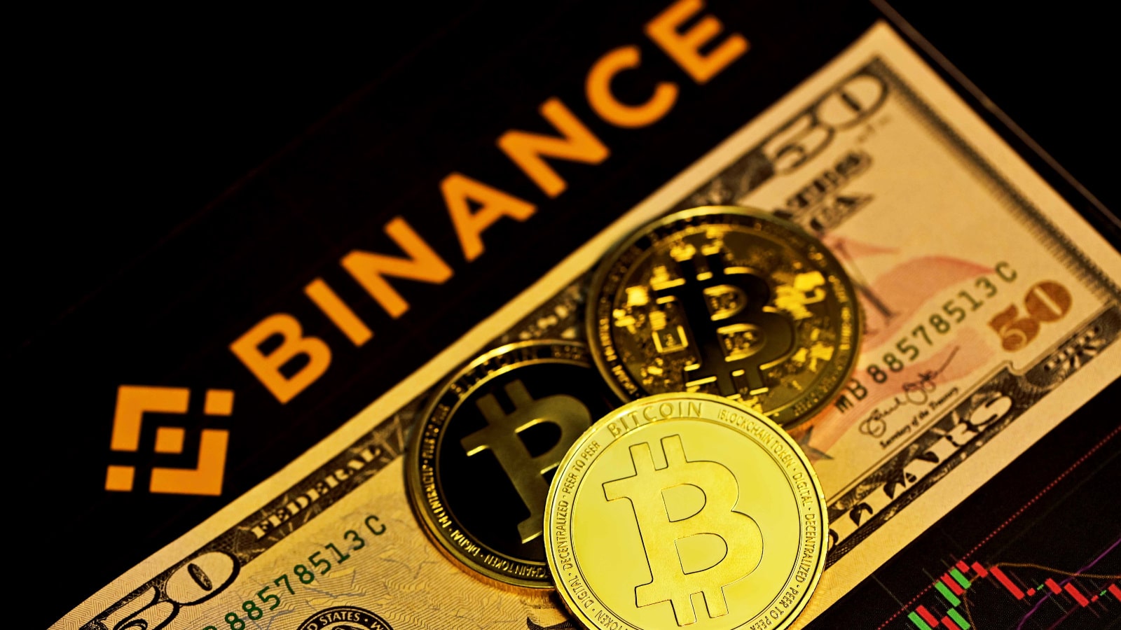 バイナンス（BINANCE）ロゴと仮想通貨とお金の画像